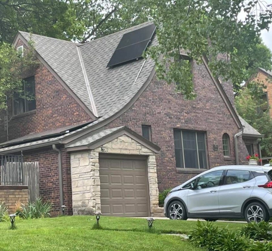Solar panels installed on a brick Tudor home in Omaha